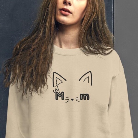 A JaiToria Cat Mom crewneck, worn